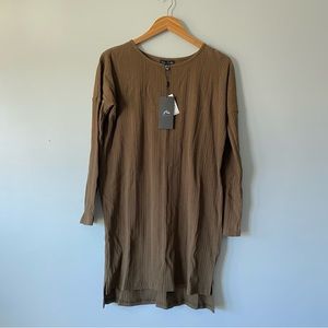 Long sleeved, form-fitting, stretchy dress.